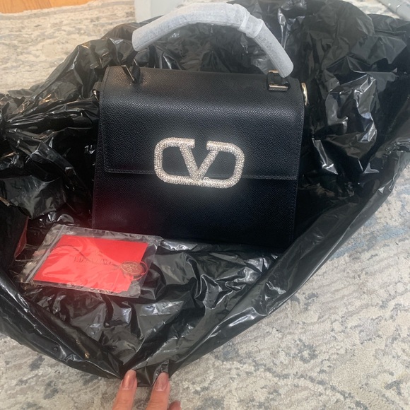 Handbags - Elegant Black Satchel with Silver Logo